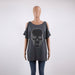 Gray oversized shirt with a skull design on a mannequin against a white background