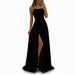 Person wearing a black dress with a high slit in a store setting