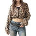 Person wearing a leopard print hoodie and jeans with a white background